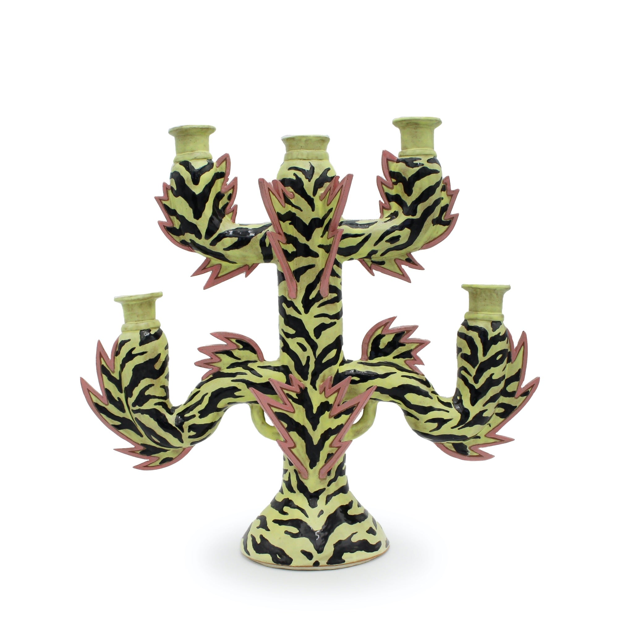 Ceramic candelabra with tiger stripe design on a white background