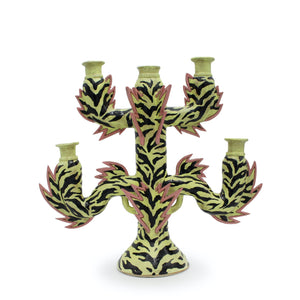 Ceramic candelabra with tiger stripe design on a white background